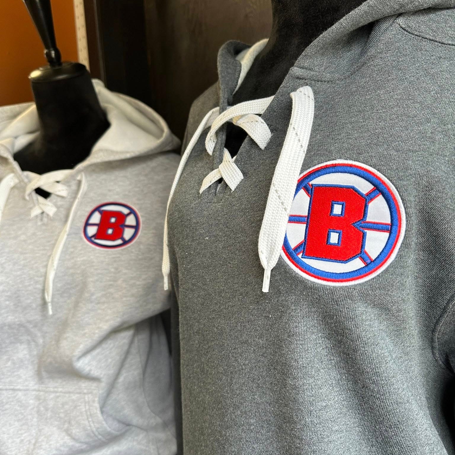 Brookings Rangers B logo stitched onto a hockey hoodie by Cotton and Customs LLC.