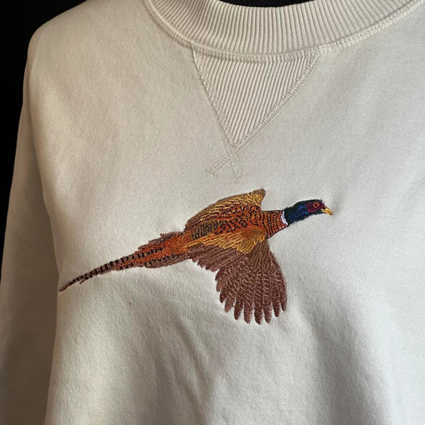 White sweatshirt with a embroidered pheasant design