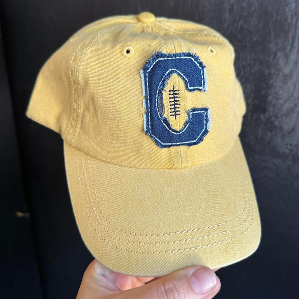 yellow unstructured Dad Hat with applique C football in Volga SD