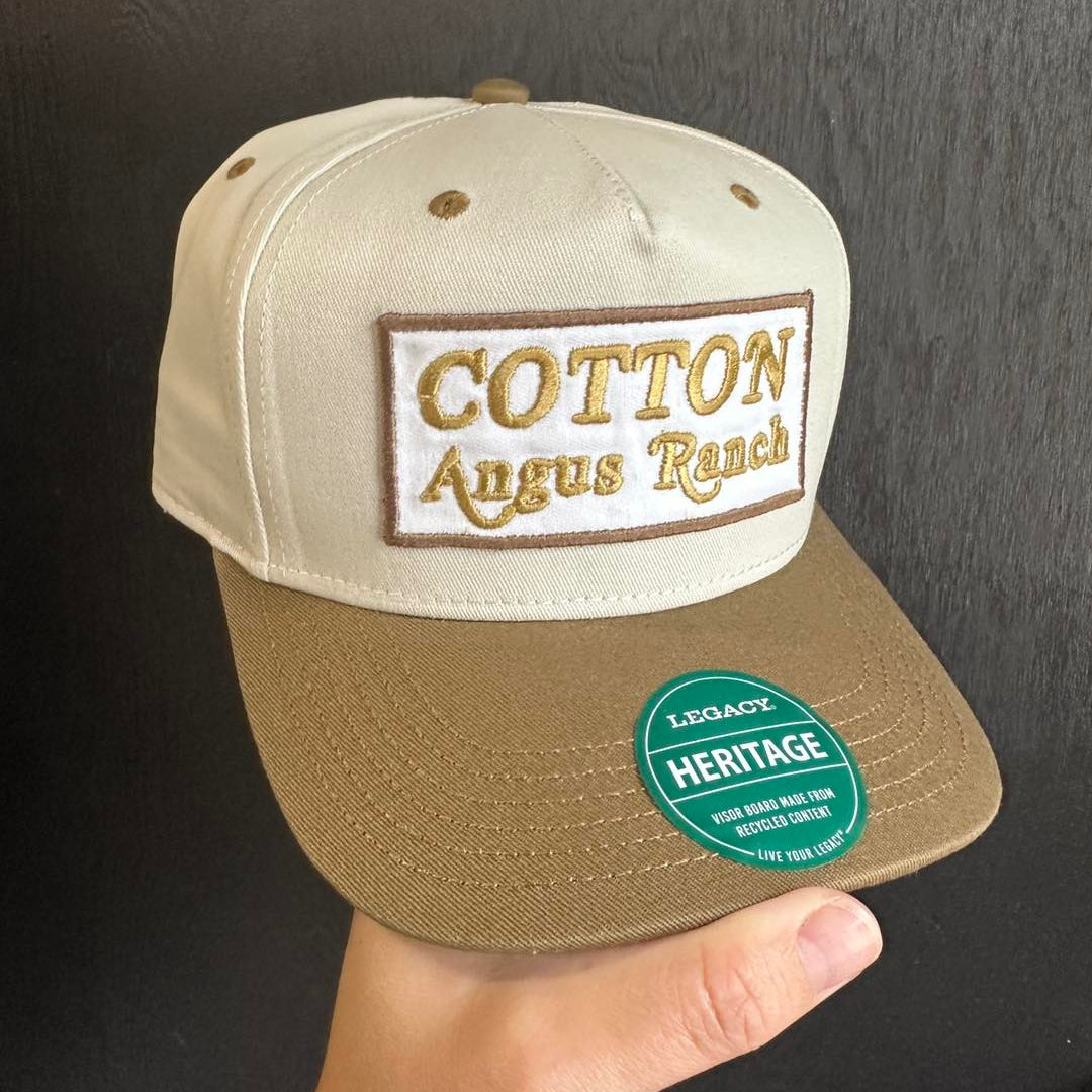 Curved bill hat featuring embroidered patch branding for local rancher
