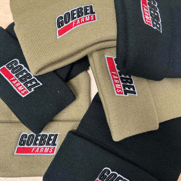 Close-up of custom embroidery showing texture and thread detail on stocking caps